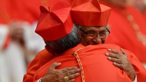 Cardinals they hug each other after a consistory for the creation of 14 new cardinals lead by Pope Francis at St Peter's Basilica in Vatican.