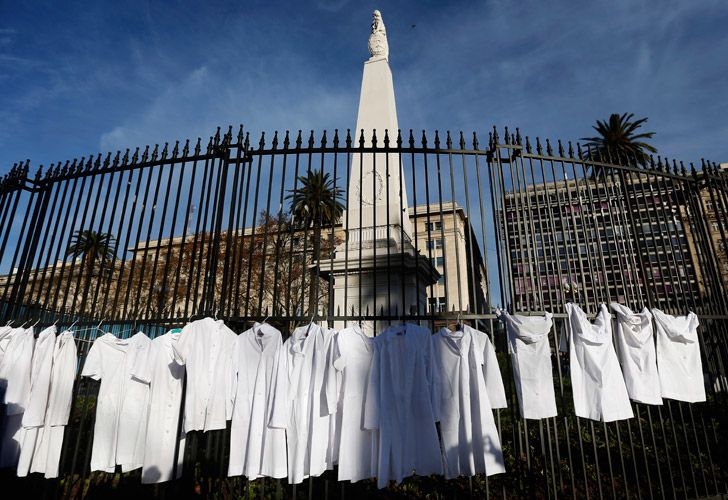 White medical coats hang from the iron gate that surrounds the national May Pyramid monument, as a symbolic act by the Doctors for Life campaign group against efforts to legalise abortion.