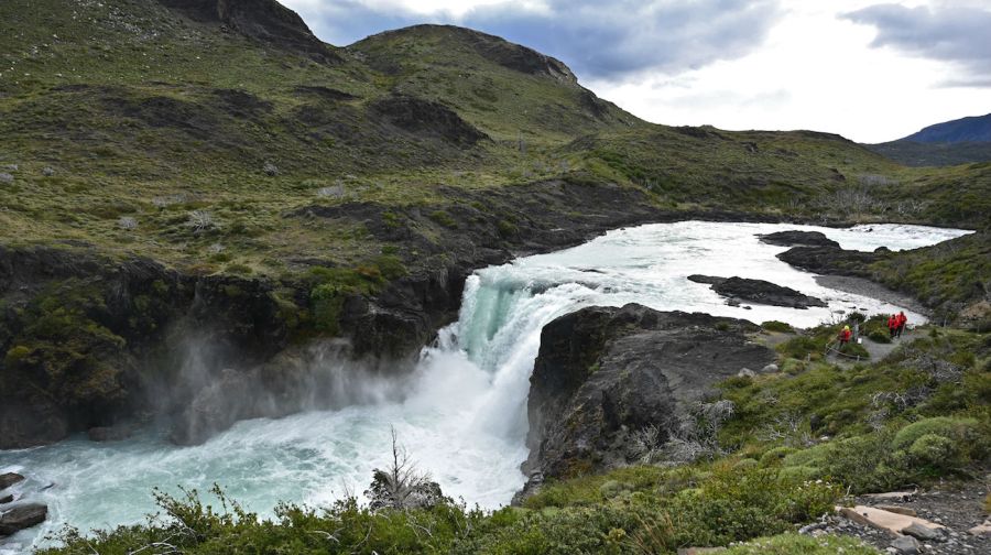 Tourists at waterfall in Torres del Paine Nartional park stock 