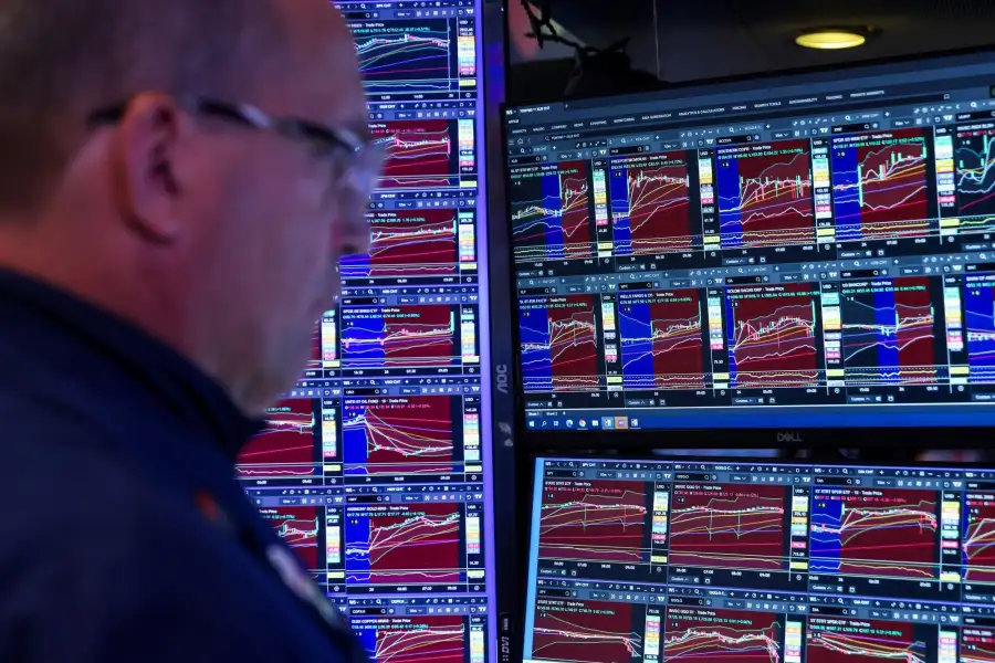 A trader works on the floor of the New York Stock Exchange.