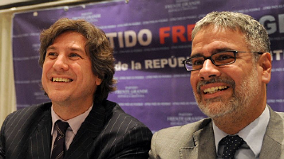 El secretario de Política Económica, Roberto Feletti, junto al ministro Amado Boudou en un acto partidario.