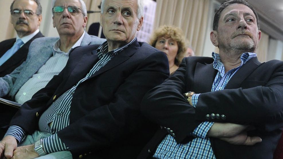 Caras largas. Lingeri, Caló y Viviani. La CGT oficial tiene al menos un proyecto en marcha.