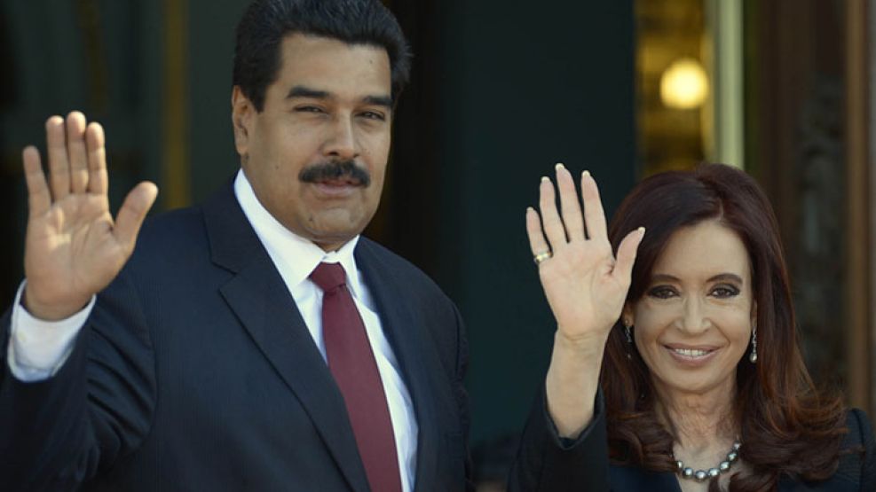 Nueva pareja. Maduro y Cristina, los presidentes que atraviesan un momento de dificultades.