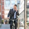 34943041-full-length-of-handsome-men-go-to-on-riding-bicycle-by-building
