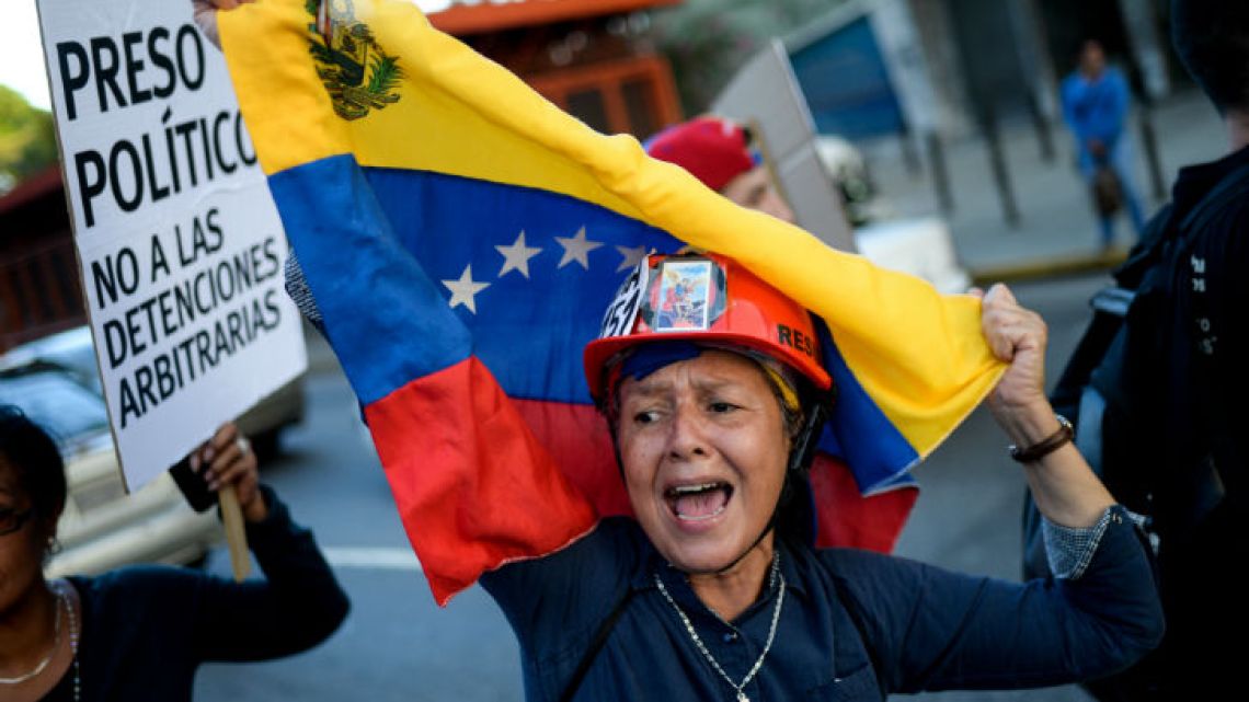 Venezuelan opposition activists carry out a rally in Caracas this week.