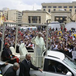 Pope Francis greets the crowd as he arrives at Bolívar Square in Bogotá on Thursday.