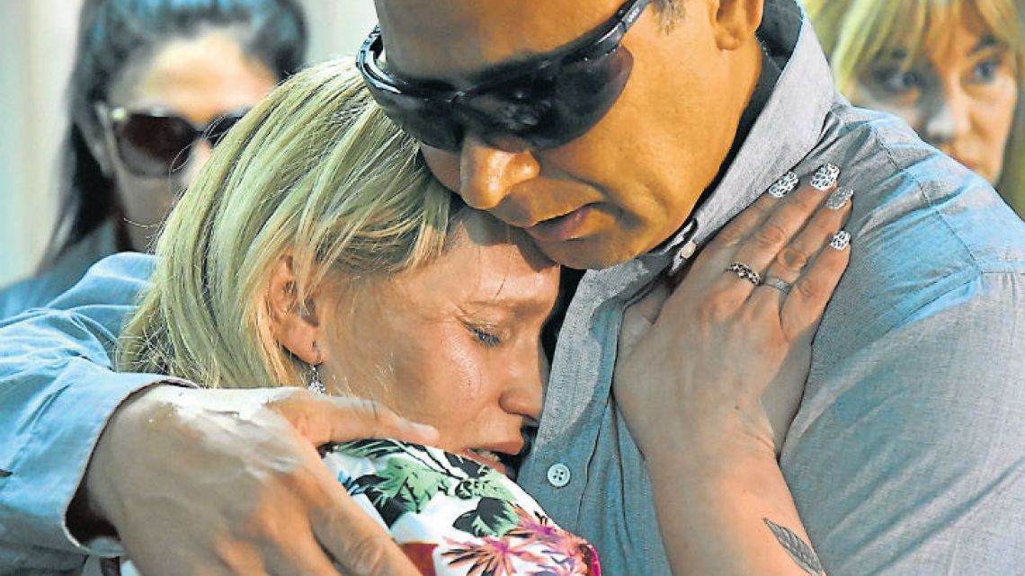 Candela's mother, Carola Labrador, cries after hearing the sentence.