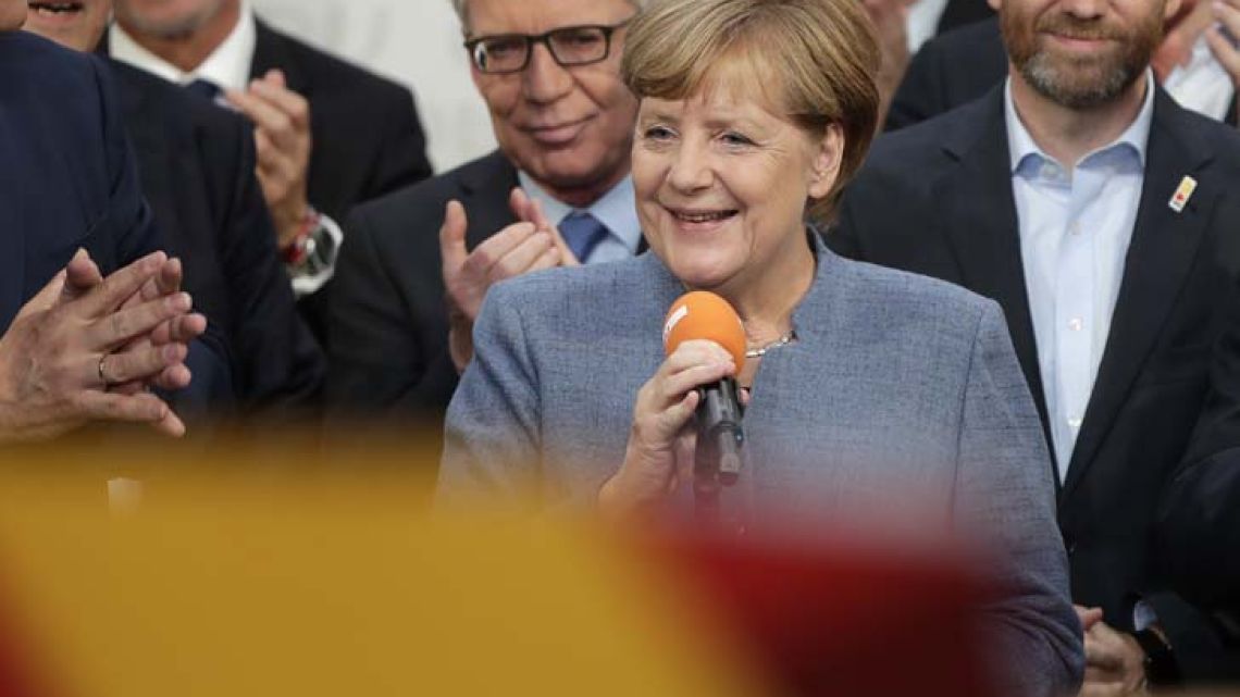 Chancellor Angela Merkel won a fourth term Sunday night, but now faces the tricky prospect of forming a coalition with two disparate new partners after voters weakened her conservatives and a far right, nationalist, anti-migrant party surged into Parliament.