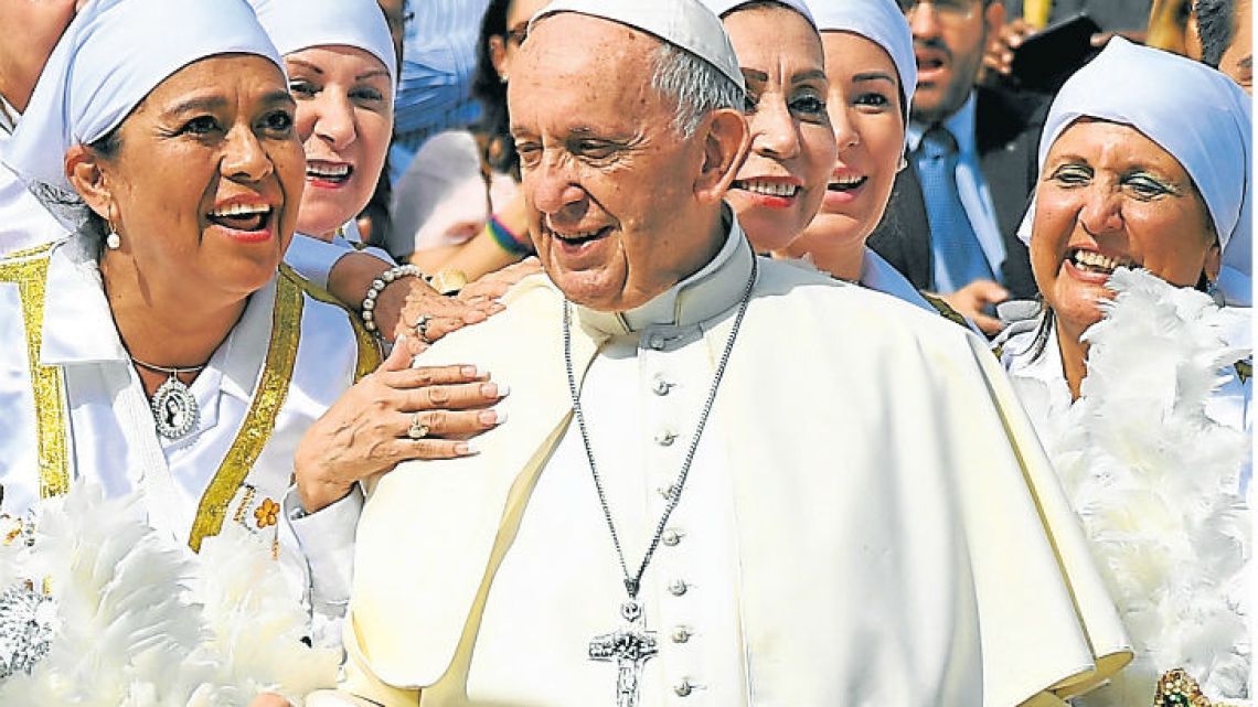 Pope Francis poses with a group of Mexican pilgrims during his weekly general audience at St. Peter’s square at the Vatican.