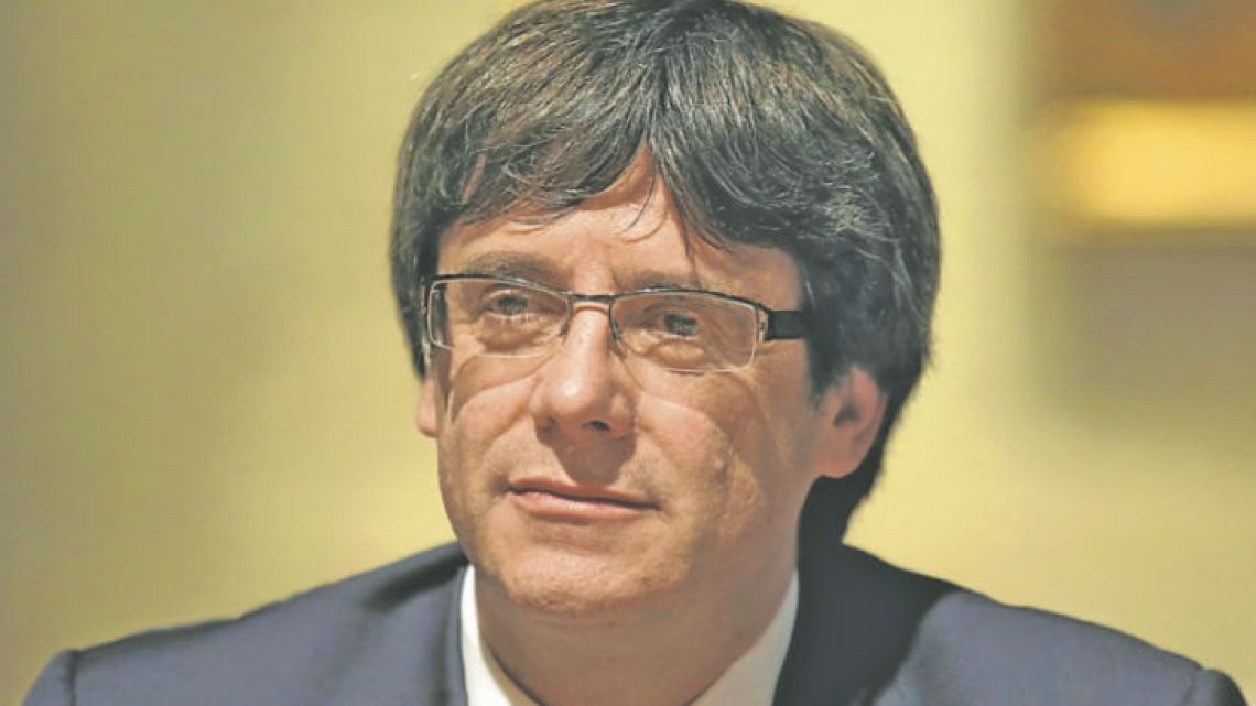 Catalan president Carles Puigdemont looks on during a meeting at the Generalitat Palace in Barcelona yesterday.