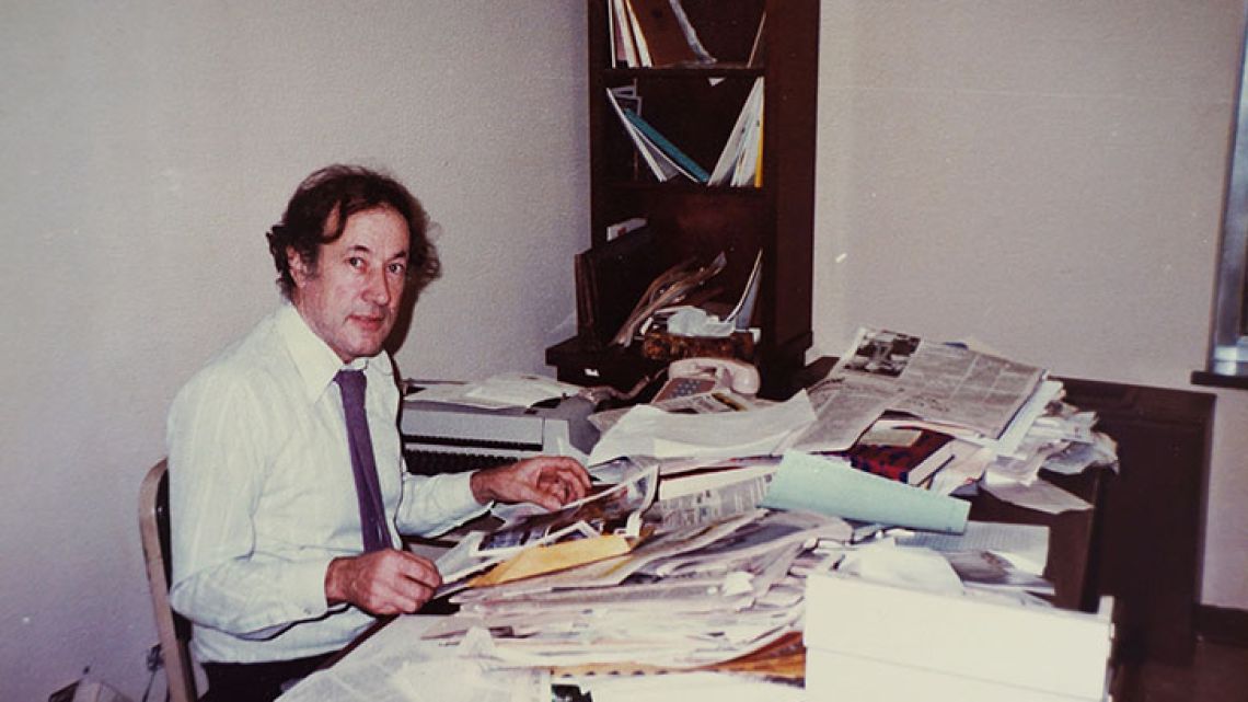 Robert Cox sits at his desk in his office at the Buenos Aires Herald, in the 1970s.