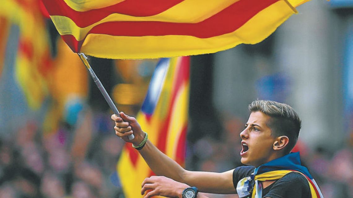 Pro-independence supporters flooded the streets of Catalonia yesterday after the Parliament voted to break away from Spain and proclaim a republic.