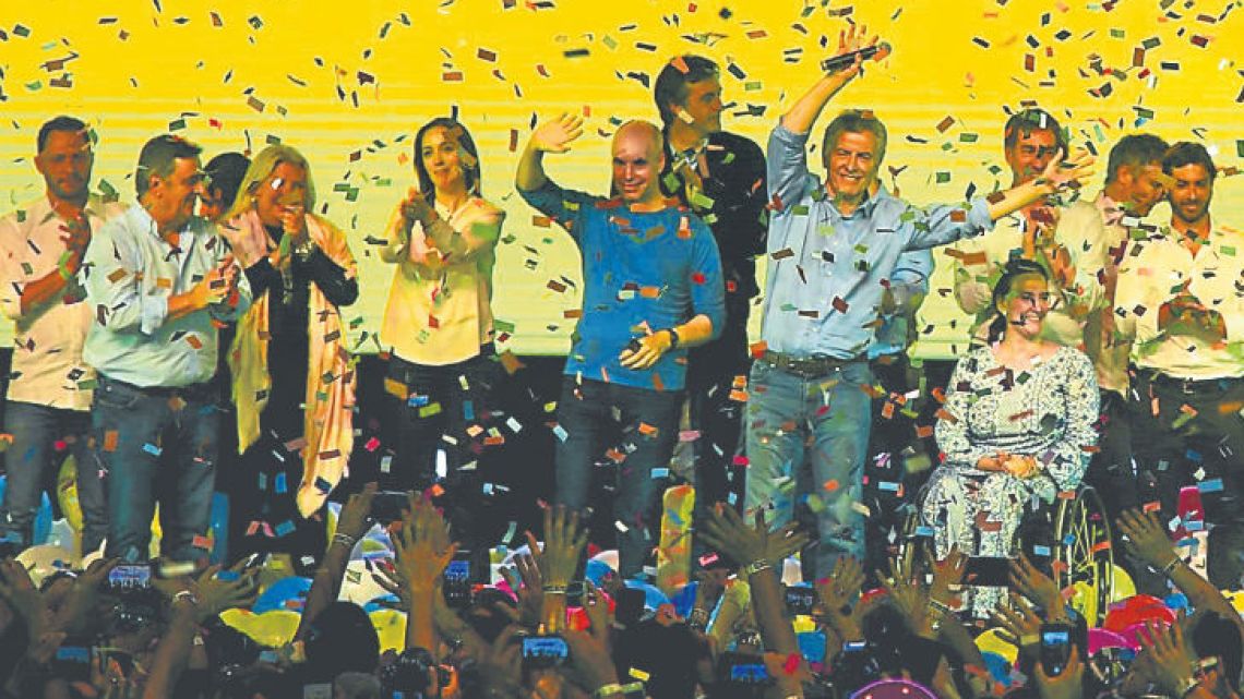 President Mauricio Macri celebrates with Buenos Aires Province Governor Maria Eugenia Vidal onstage, at the election night rally at the Cambiemos bunker in Costa Salguero.