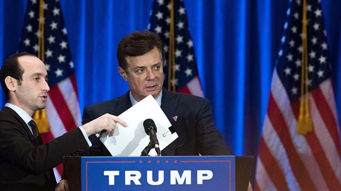 This file photo taken on June 21, 2016 shows former Trump campaign chairman Paul Manafort checking the podium before Donald Trump speaks during an event at the Trump SoHo Hotel, in New York City.