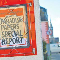 A billboard for the Jersey Evening Post newspaper advertises a special news report in St Helier, Jersey. The channel island has come under the spotlight with the publication of the Paradise Papers, highlighting its status as a tax destination for multinational companies.