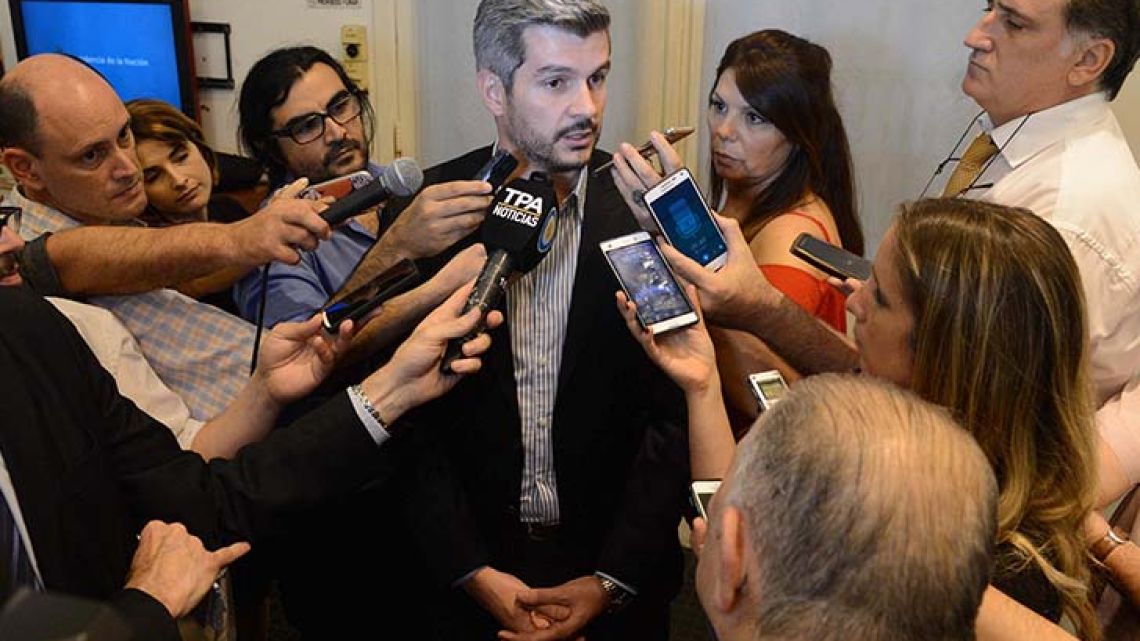 Cabinet Chief Marcos Peña addresses reporters at Government House on December 8, 2017.