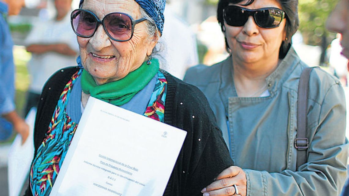 Mother of fallen Malvinas soldier Macedonio Rodríguez, María Inés Romero, left, leaves the National Memory Archive, accompanied by her daughter Eulogia Rodriguez, after being notified that her son’s remains, buried in an anonymous grave, have been identified.