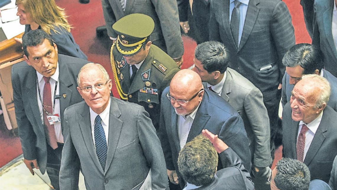Peruvian President Pedro Pablo Kuczynski (second from left) is pictured after speaking before the Peruvian National Congress in Lima on Thursday.