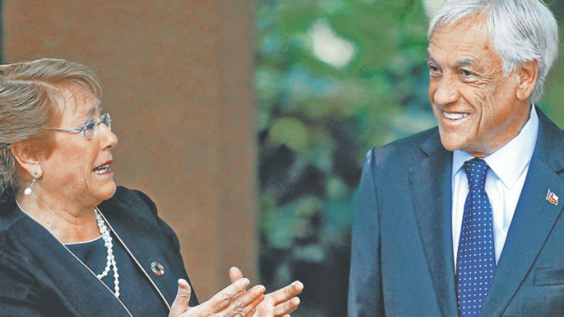 Chilean president-elect Sebastian Piñera greets President Michelle Bachelet (left) upon her arrival at his residence in Santiago on Monday. The 68-year-old conservative billionaire will return to power next year.