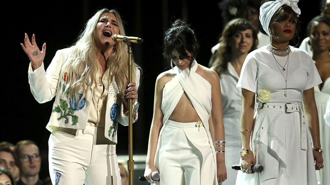Kesha (left) performs 