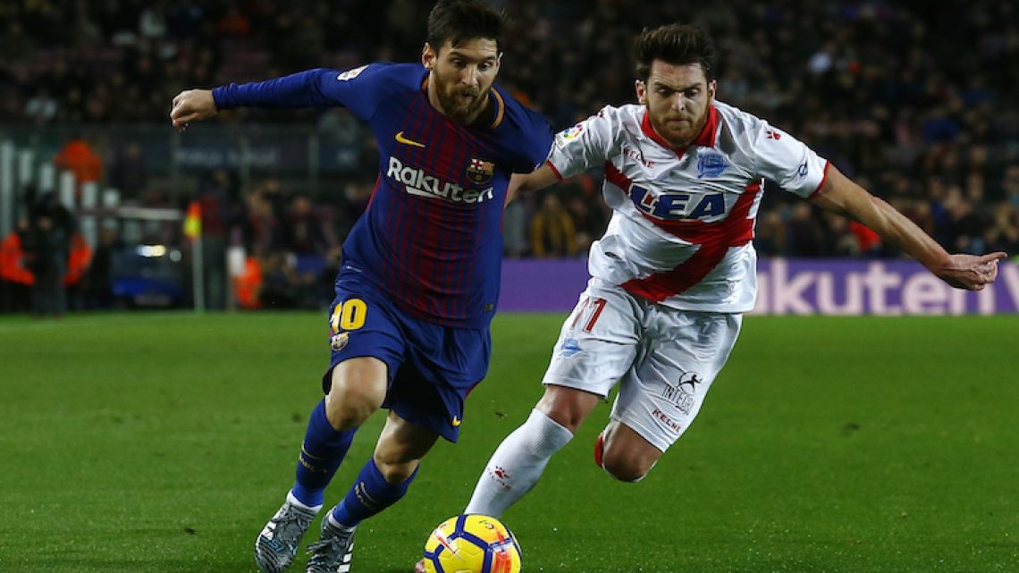Lionel Messi, left, duels for the ball against Alavés player Ibai Gomez in a league match last weekend in which Messi scored the winning goal.