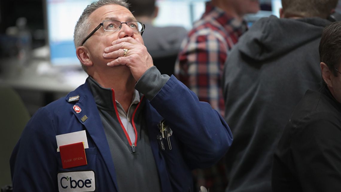 A trader watches prices in the VIX pit at the Cboe Global Markets, Inc. exchange (previously referred to as CBOE Holdings, Inc.) in Chicago, Illinois.
