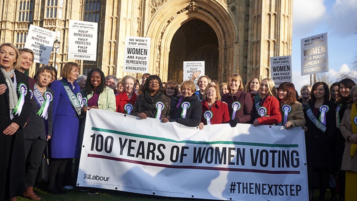 Female MPs from the opposition Labour Party pose for a photograph outside the British Houses of Parliament to mark the centenary of women's suffrage in London on February 6, 2018 Prime Minister Theresa May led tributes to the 
