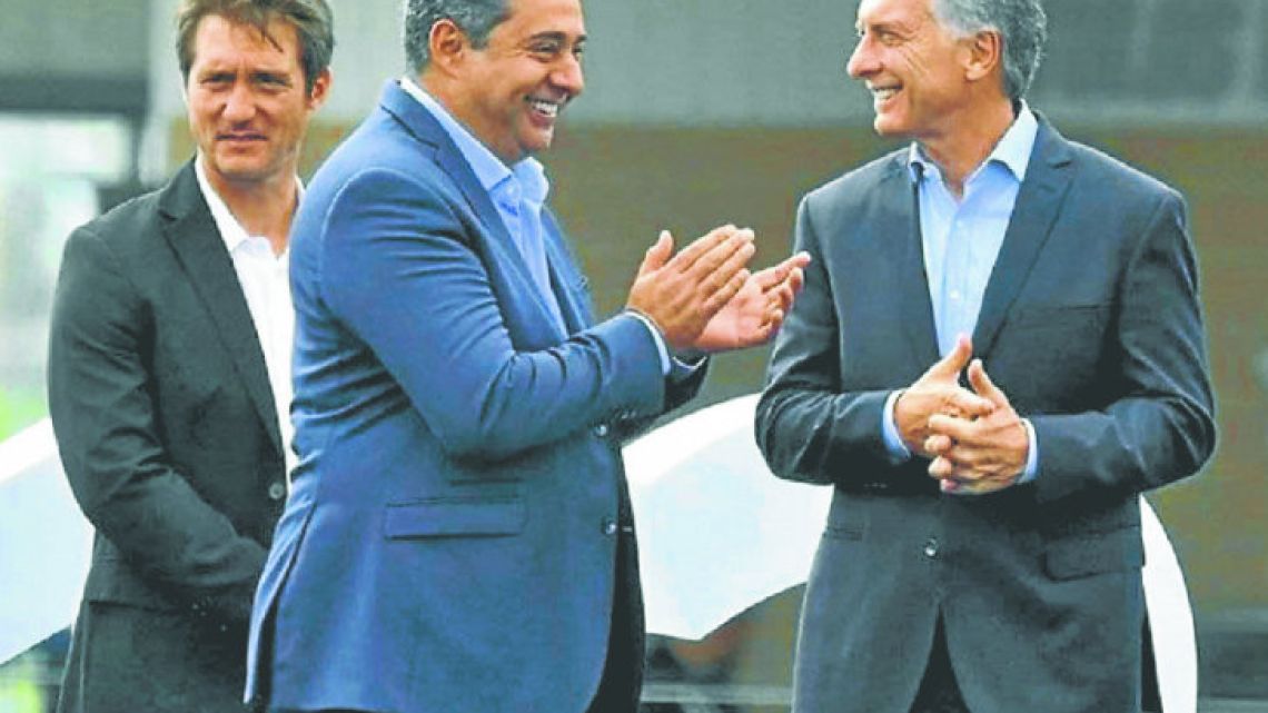 Boca coach Guillermo Barros Schelotto (left), club President Daniel Angelici (centre) and President Mauricio Macri.