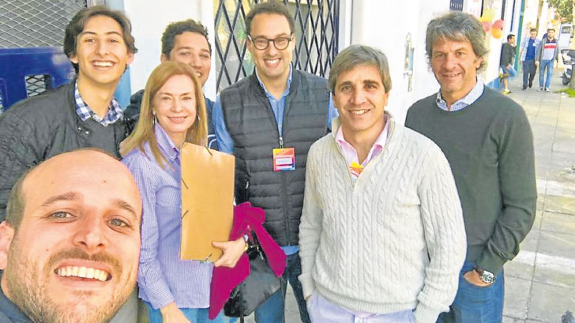 Leandro Cuccioli (third from the right) is seen with Finance Minister Luis Caputo (second from the right) during door-knocking for the 2017 mid-term campaign.