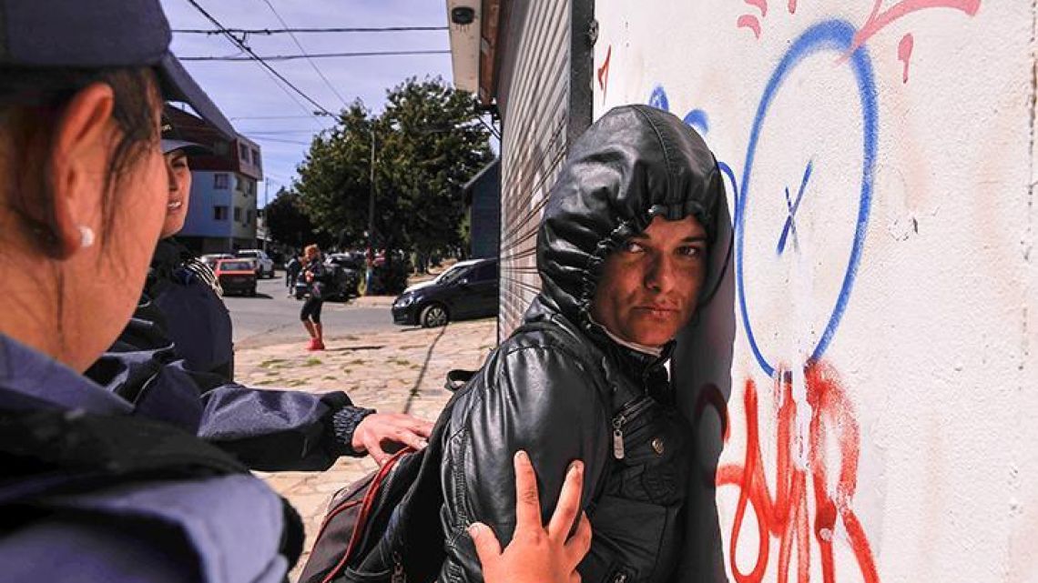 Police detain a protester as tensions heightened in the city of Bariloche over the extradition of Facundo Jones Huala.