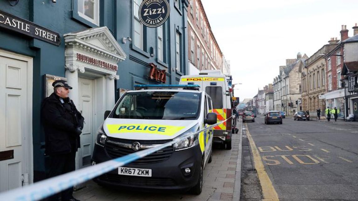 A policeman stands outside the Zizzi restaurant in Salisbury, close where former Russian double agent Sergei Skripal was found critically ill. Britain's counterterrorism police took over an investigation Tuesday into the mysterious collapse of a former spy and his daughter, now fighting for their lives. Sergei Skripal and his daughter are in a critical condition after collapsing in the English city of Salisbury on Sunday.
