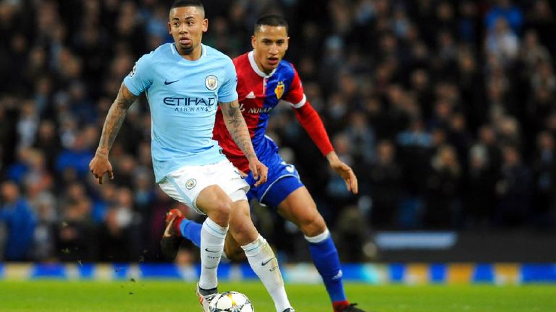 Manchester City forward Gabriel Jesus, left, dribbles during City’s Champions League Round of 16 second leg match against FC Basel in Manchester, England on Wednesday.