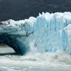 Chuncks of ice come off from the Perito Moreno glacier, at Los Glaciares National Park, near El Calafate in the province of Santa Cruz, on March 11, 2018.