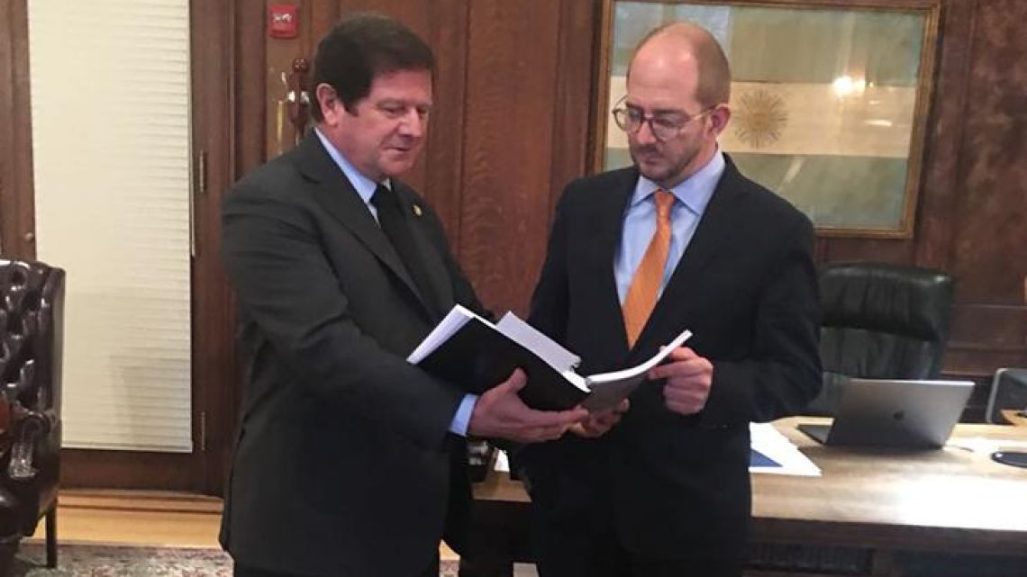 Argentina's Ambassador the United States Fernando Oris de Roa and Commerce Secretary Miguel Braun.