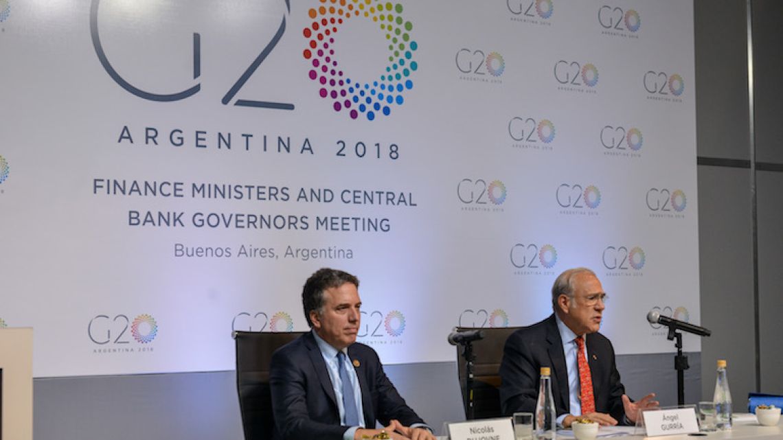 Nicolás Dujovne, the Argentine finance minister, and José Ángel Gurría, secretary-general of the OECD, speak at a press conference on the first day of G20 finance leader meetings in Buenos Aires on Monday. 