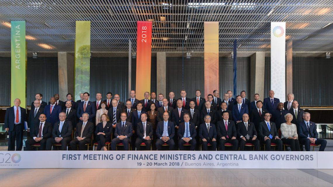 Finance ministers and central bank governors pose for a group photo at the end of the first day of G20 talks in Buenos Aires on Monday.