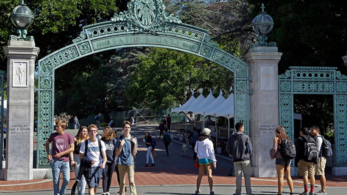 Students walk past Sather Gate on the University of California, Berkeley campus in Berkeley, California.