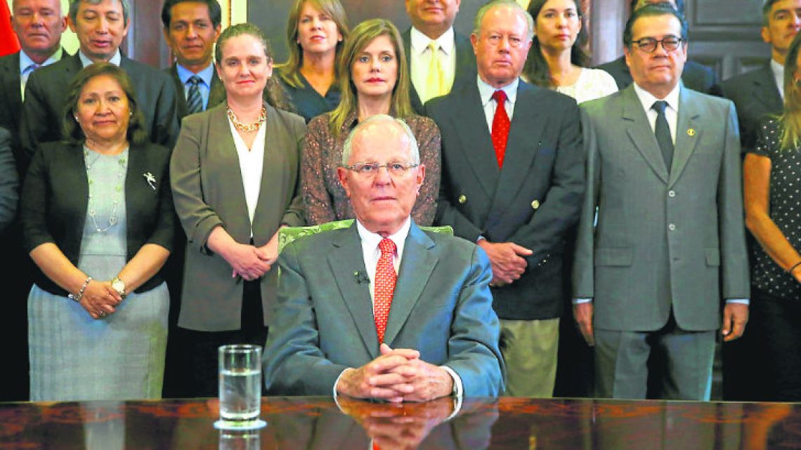 President Pedro Pablo Kuczynski poses with his Cabinet, before addressing the nation and announcing his resignation from office on Wednesday.