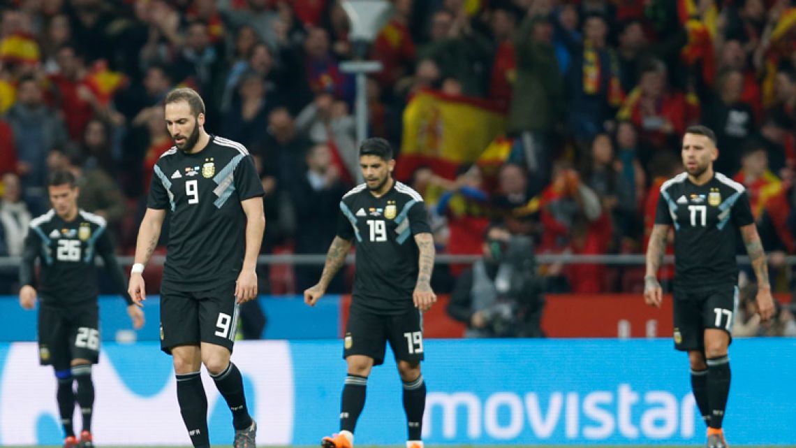 Argentina's players react after Spain score another goal during the 6-1 international friendly match against Spain at the Wanda Metropolitano stadium in Madrid.