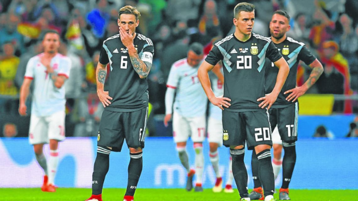 Argentina midfielder Lucas Biglia, midfielder Giovani Lo Celso and defender Nicolas Otamendi react after Spain’s sixth goal, during Tuesday’s 6-1 international friendly defeat at the Wanda Metropolitano Stadium in Madrid.