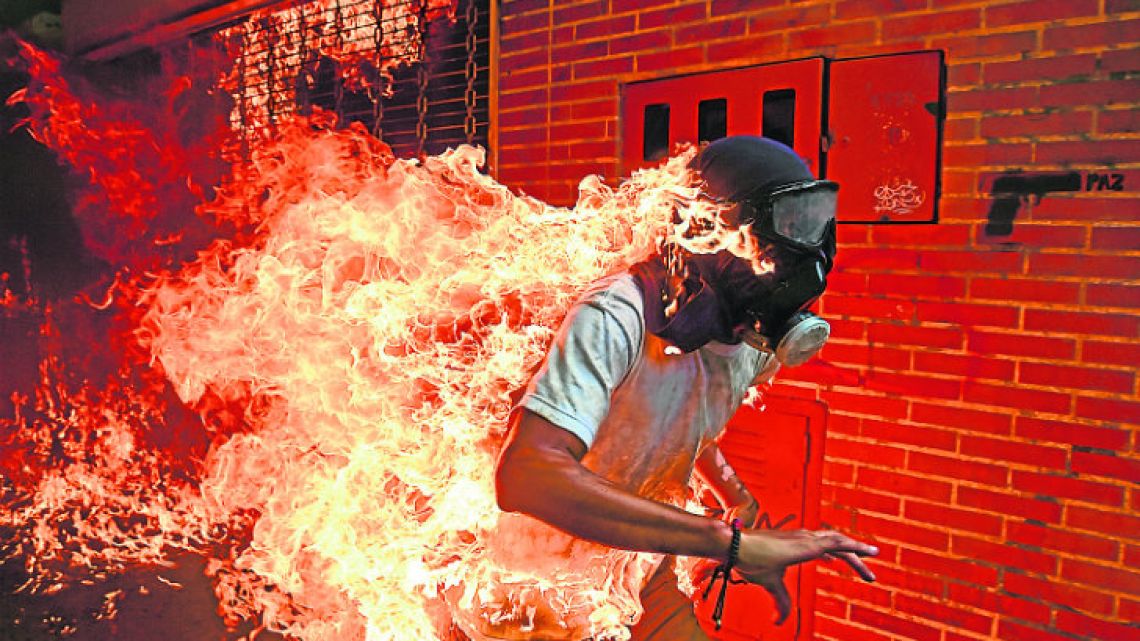 Víctor Salazar went up in flames as he and other protestors were trying to destroy a police motorbike and the gas tank exploded in his face.