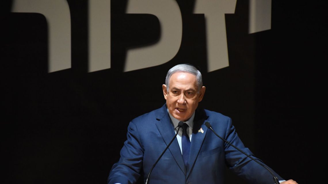 Israeli Prime Minister Benjamin Netanyahu speaks at the official ceremony for Israel's Remembrance Day for fallen soldiers in the Mt. Herzl Military Cemetery in Jerusalem on April 18, 2018.