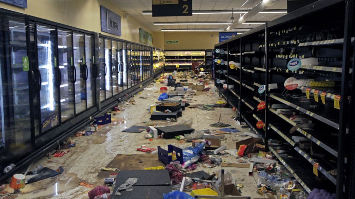 View of a supermarket after lootings during protests against the government's reforms in the Institute of Social Security (INSS) in Managua on April 22, 2018. Nicaragua's President Daniel Ortega agreed Sunday to scrap a highly-controversial reform of the country's pension law that sparked four days of violence, leaving 24 people dead.