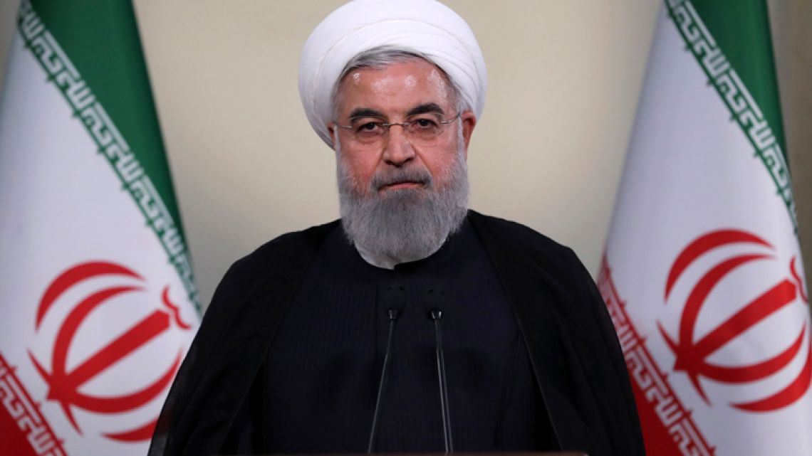 President Hassan Rouhani addresses the nation in a televised speech in Tehran, Iran, Tuesday, May 8, 2018