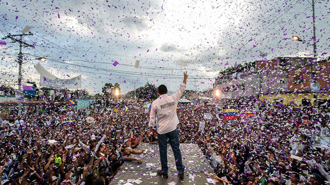 Venezuelan opposition presidential candidate and evangelical pastor Javier Bertucci, waves to supporters during his campaign closing rally in Valencia, Venezuela on May 16, 2018.