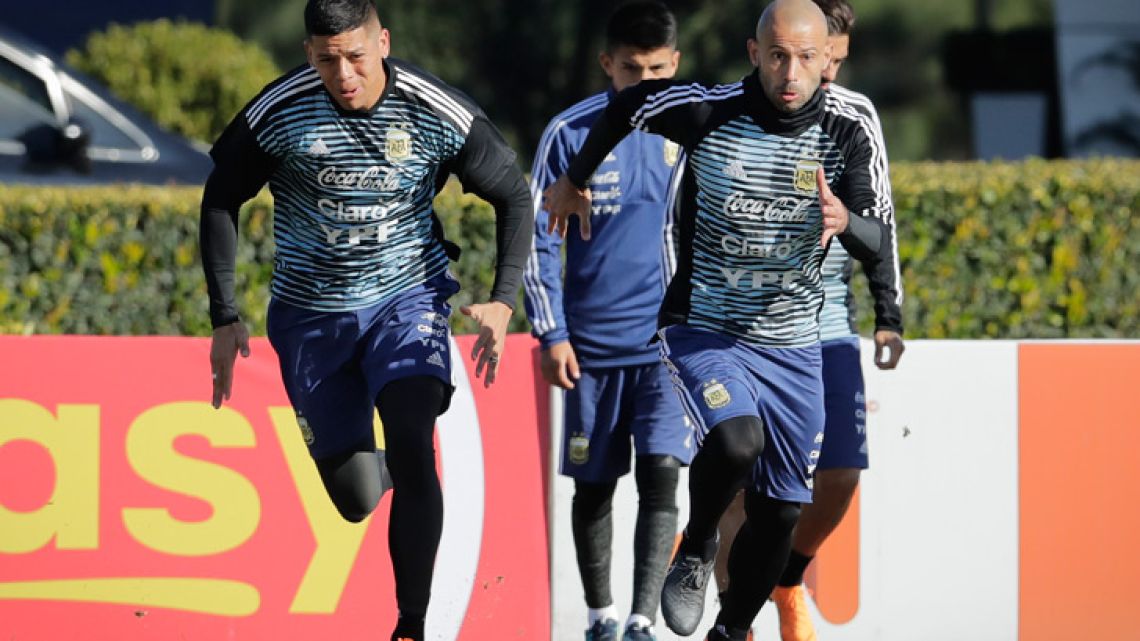 Javier Mascherano, right, and Marcos Rojo attend a training session in Ezeiza.