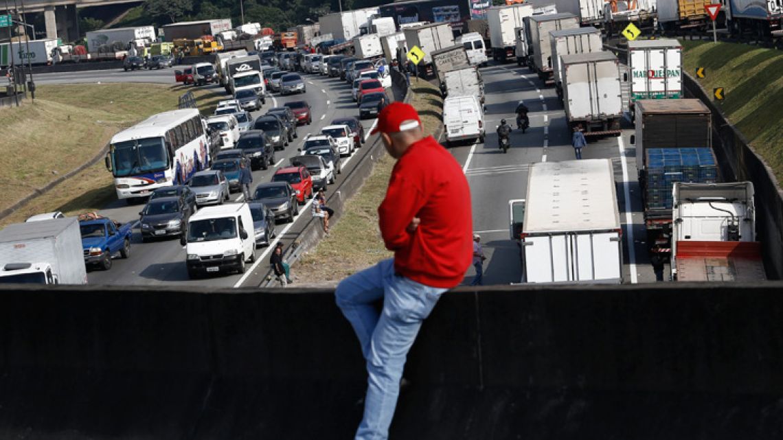 Brazilian truck drivers block the Regis Bittencourt road, 30 kilometres from São Paulo, during a strike to protest rising fuel costs in Brazil.