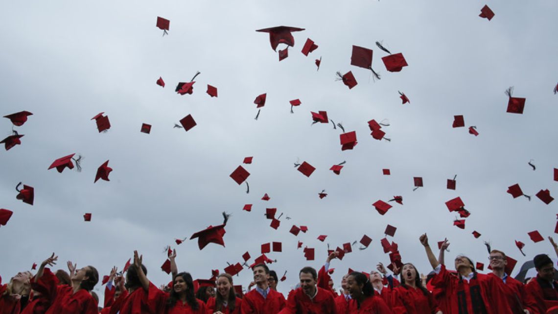Students toss their hats in the air at the conclusion of their commencement ceremony at Wesleyan University in Middletown, Connecticut.
