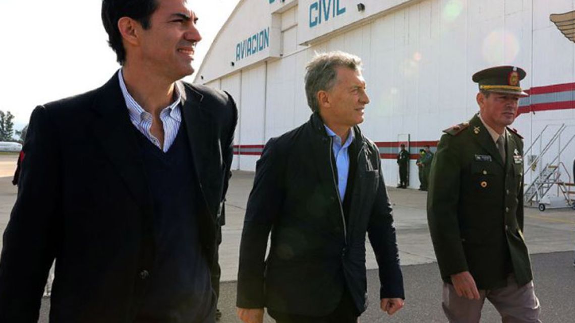 Salta governor Juan Manuel Urtubey (left) walks with President Mauricio Macri (centre) in Salta in May, 2018.