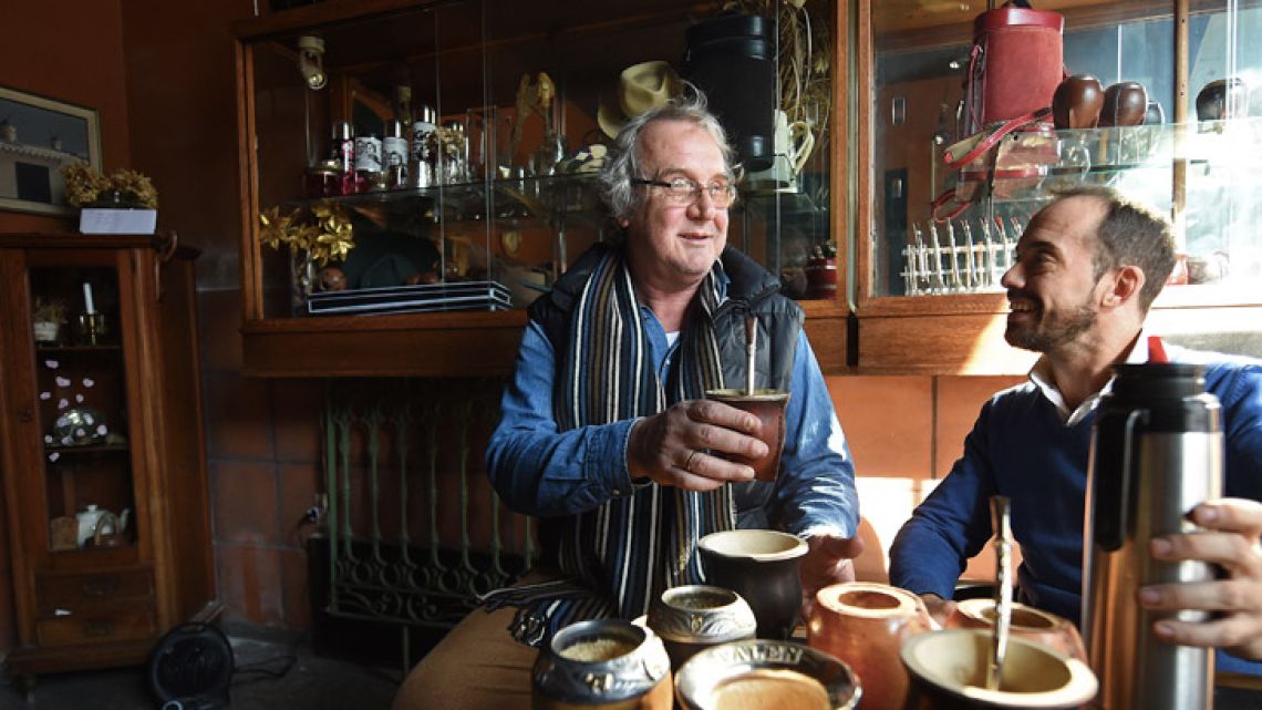 Jorge Francisco (right) and Federico Bresciani, manager and owner of traditional handmade silverware store Bresciani, drink mate at their store in Montevideo. Bresciani has made mates for several footballers, including Lionel Messi, Luis Suárez, Edinson Cavani and Diego Godín and Frenchman Antoine Griezmann.